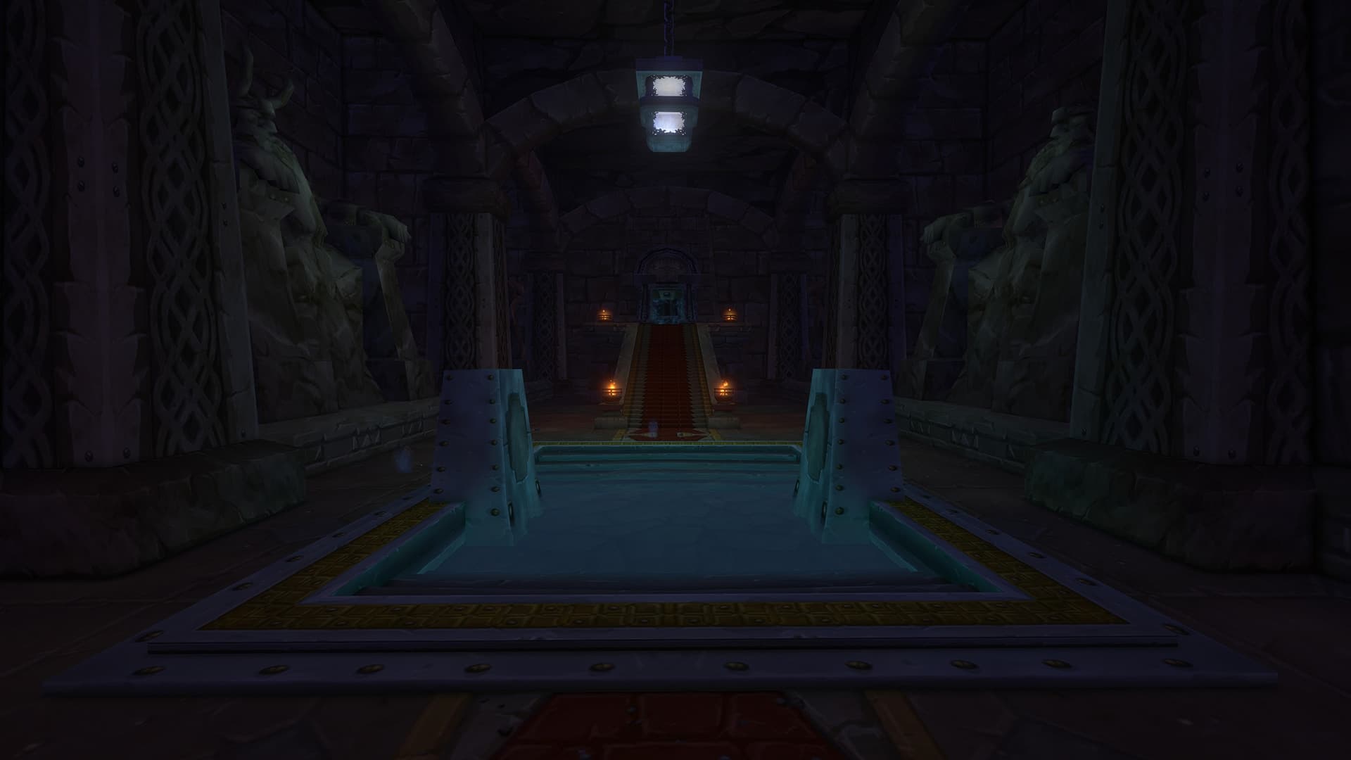 Stone guardians flank a pool and a torchlit stairway in the Hall of Thanes.